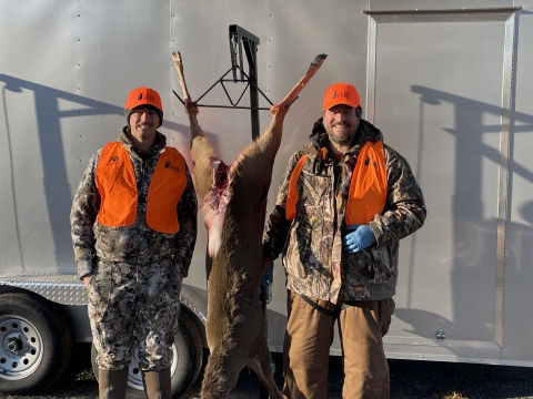 Mentor Collin (L) and Mentee Bryan (R) prepare to begin processing the doe that Bryan harvested as part of the Field to Fork mentored rifle deer hunt at Cherry Valley National Wildlife Refuge in December 2024