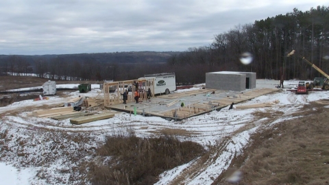 photo showing First walls are going up on the new headquarters building