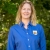 Female standing, wearing a blue shirt