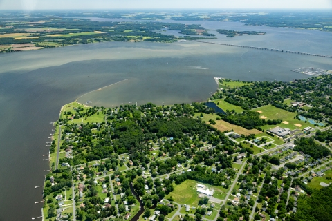 Aerial view of a river flowing past a town
