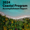 Front cover of 2024 Coastal Program Accomplishment Report with aerial photo of the Lake Michigan shoreline in Traverse City, Michigan.