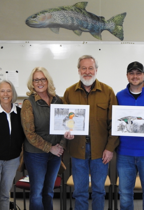 5 people posing with duck art