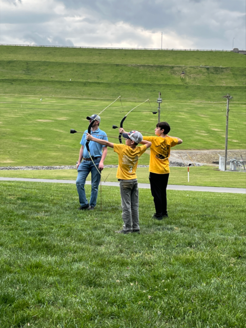 Kids shooting archery