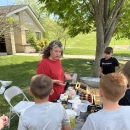 Presenter teaching kids at a booth