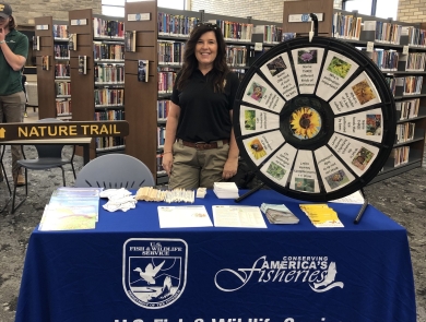 Wolf Creek National Fish Hatchery table at Read Across Russell County event 