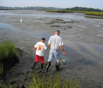 Image of an adult and youth shellfishing