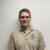 Man in USFWS uniform smiling.