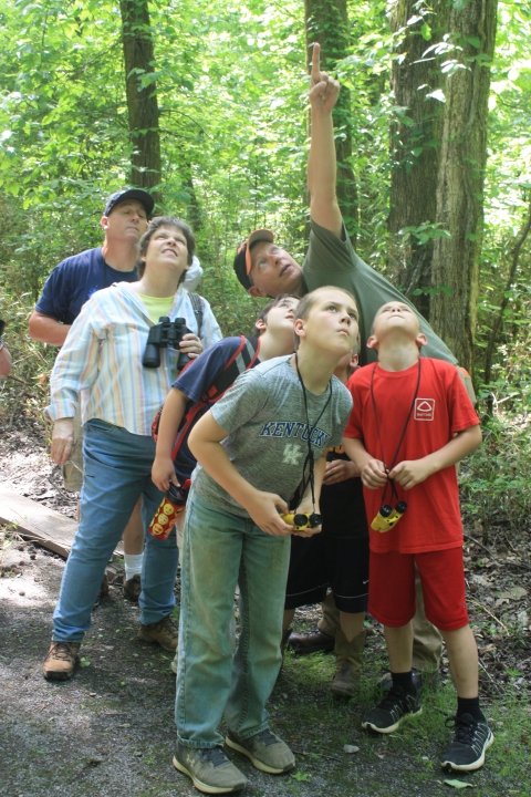 A group of people birding.
