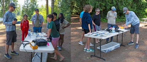 Jakob Bengelink teaching fly fishing academy campers how to use radio telemetry equipment around a table outside..