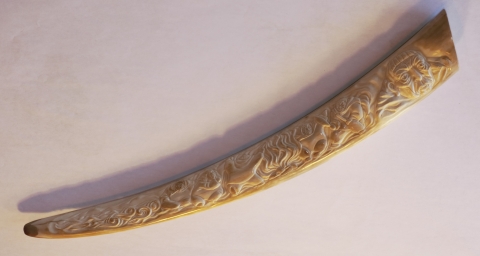 Alaska Native Handicraft Walrus tusk carved with artwork 