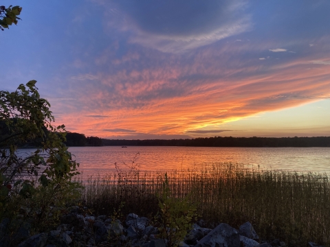 orange and blue sky over water