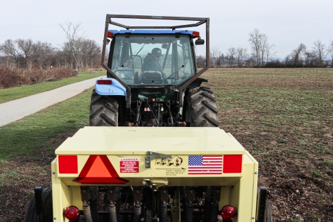 Two people in a tractor cab