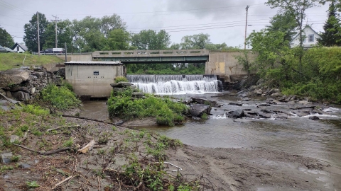 The process of dismantling a dam to restore natural water flow.