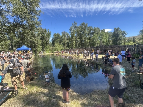 Families gather around the fishing pond at Winthrop National Fish Hatchery