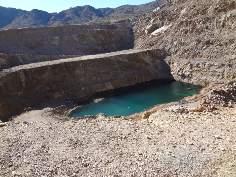 A body of water surrounded by rock