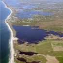 Aerial view of an undeveloped coastal freshwater pond.