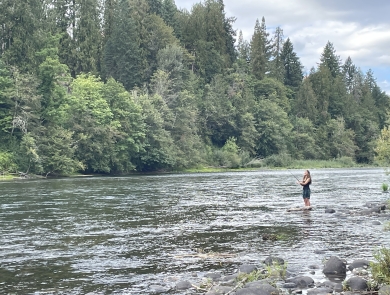 A Rosemary Anderson High School Student fishes on Oregon's Clackamas River.