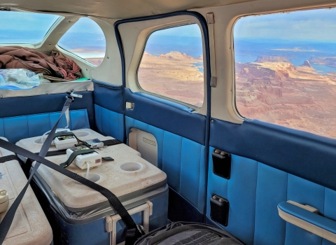 Ice chests containing woundfin with aerators inside plane mid flight. 